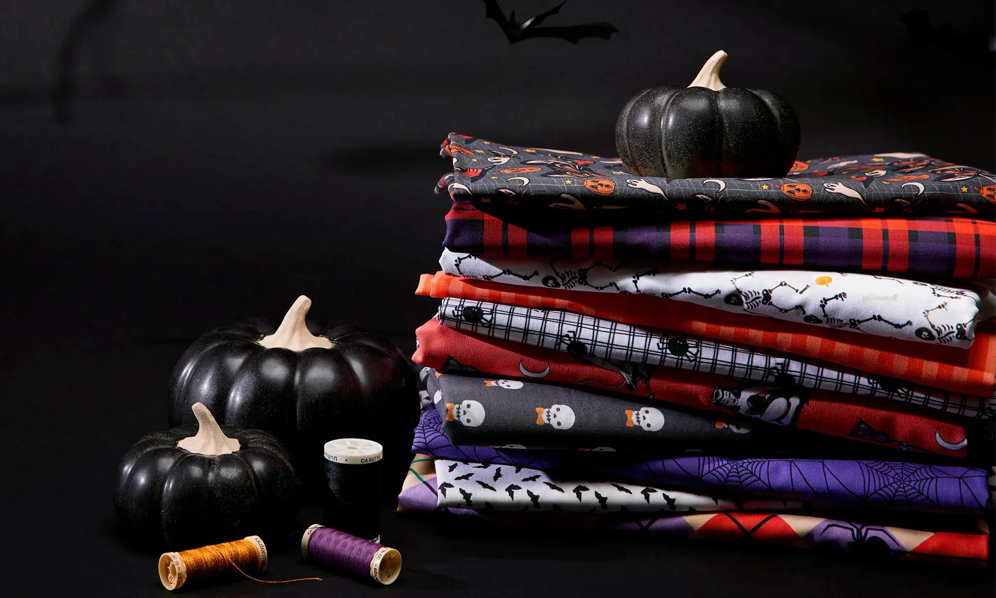 Stack of halloween fabrics.