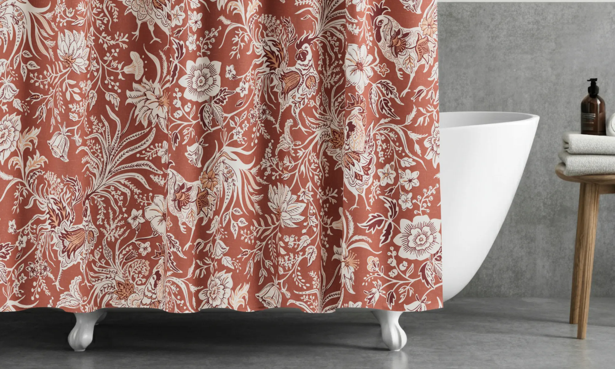 Clawfoot tub in a gray bathroom with red rooster french country shower curtain