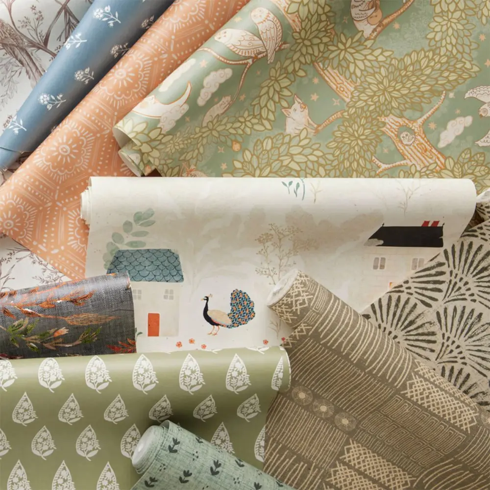 Stack of renter-friendly wallpaper rolls