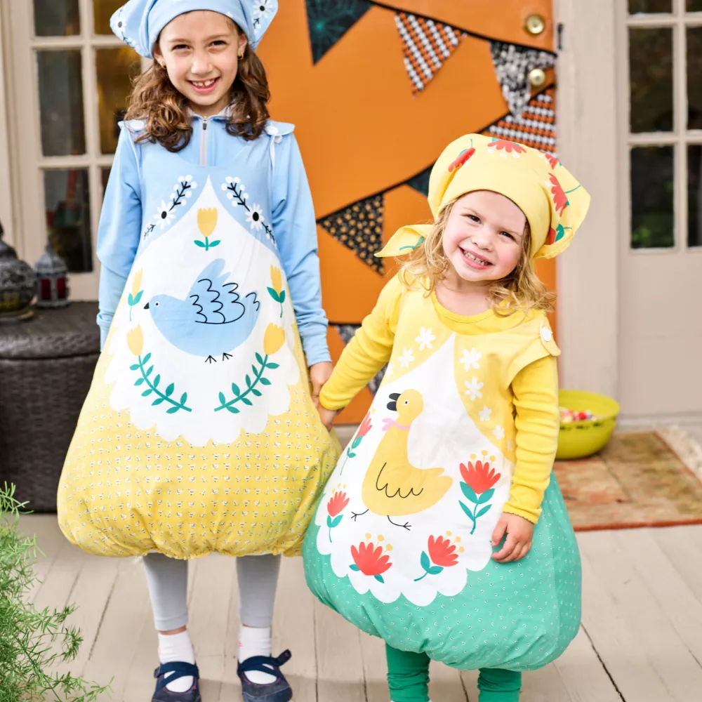 Two girls in matching folk nesting doll costumes